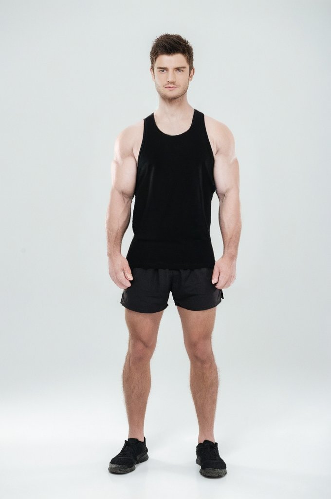 After: Before and after AI preview of bigger arms and shoulders on a slim young man in a black tank top, made in Buldy